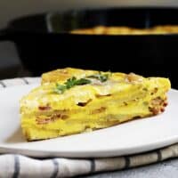breakfast frittata wedge served on a white plate