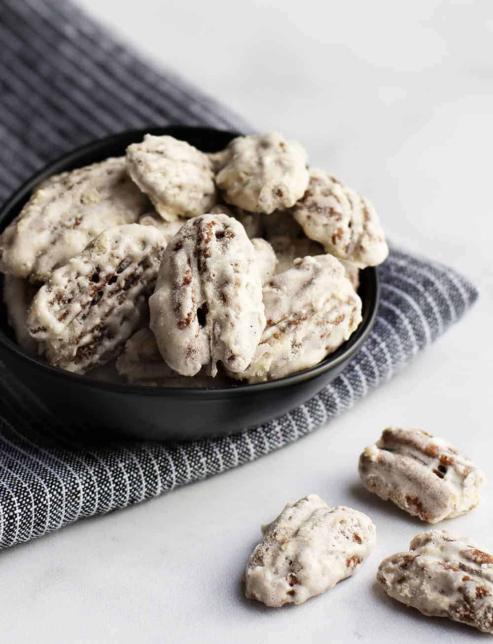 Sugared Pecans served in a black bowl
