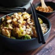 Kung Pao Brussels Sprouts served in a black bowl