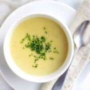 Potato Leek Soup served in white bowls