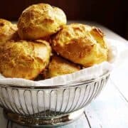 Homemade Gougeres served in wire basket featured