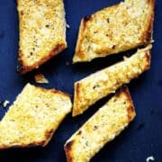 Easy-Cheesy-Garlic-Bread served on a gray board