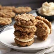 Oatmeal Sandwich Cookies stacked on a white plate