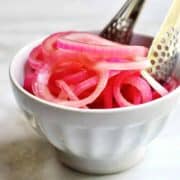 Quick-Pickled-Red-Onions served with tongs