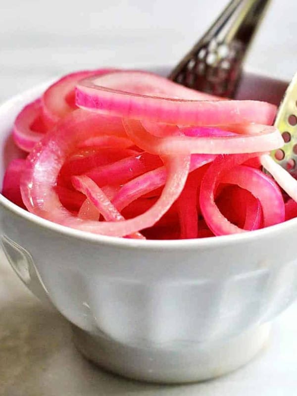 Quick-Pickled-Red-Onions served with tongs