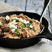 Homemade Refried-Beans served in a skillet featured