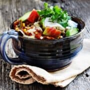 chorizo chili served in a blue ceramic bowl
