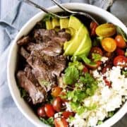 Carne-Asada-Steak-Salad served in a white bowl