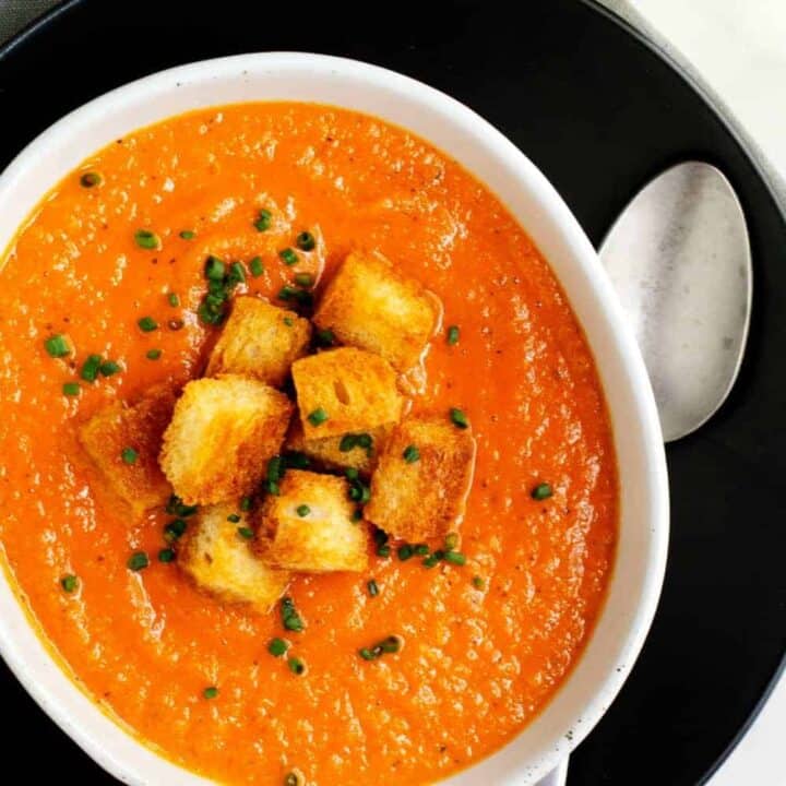 Homemade Tomato Bisque in a ceramic bowl with a swirl of cream