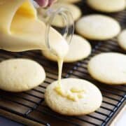 Sugar Cookie Icing pouring over soft sugar cookies