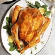 Dry Brine Turkey served on a white oval platter