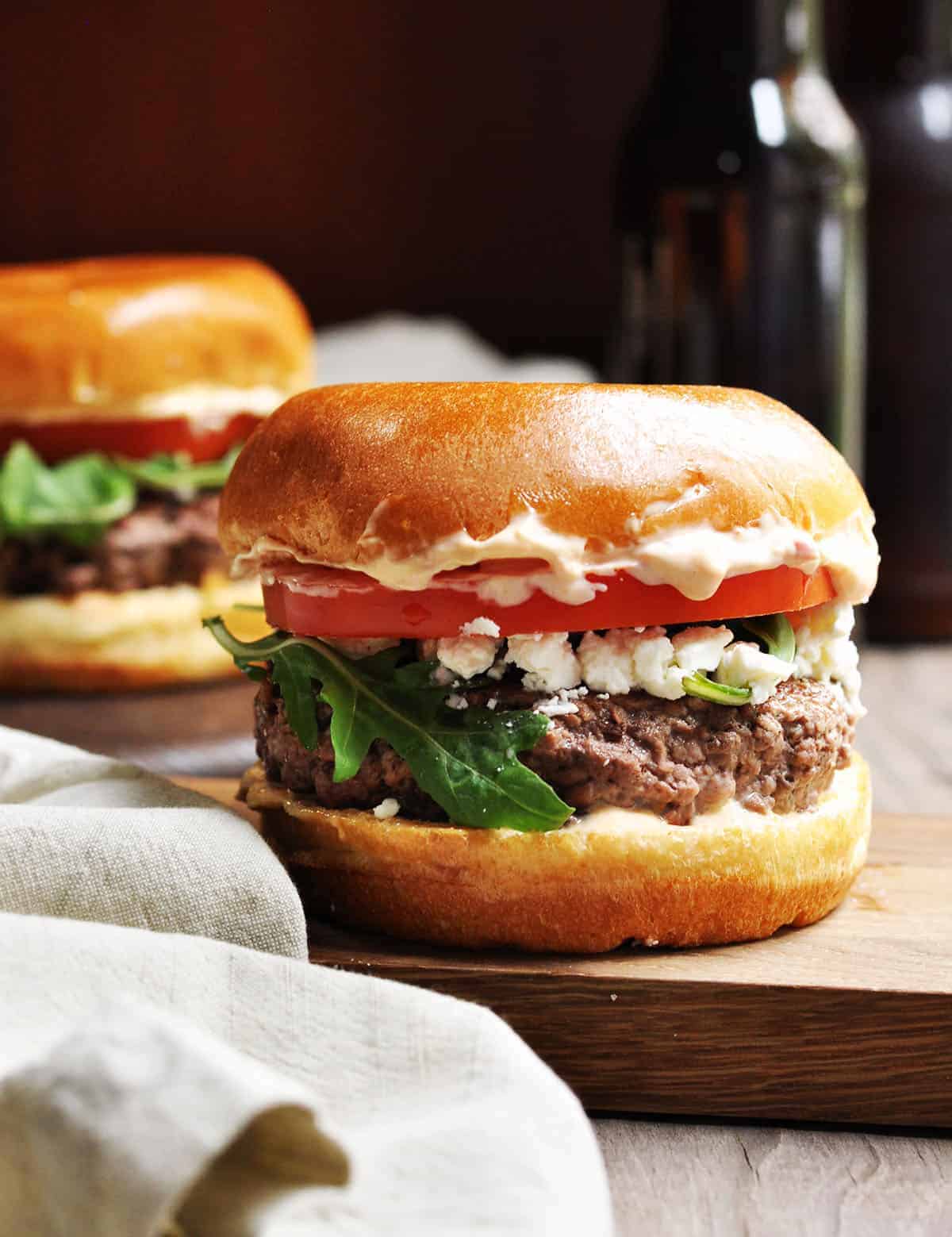 Greek Style Lamb Burgers with Feta & Harissa Aioli - Pinch and Swirl