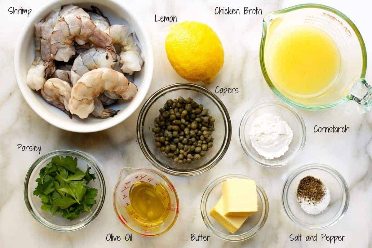 ingredients for shrimp piccata on a marble board