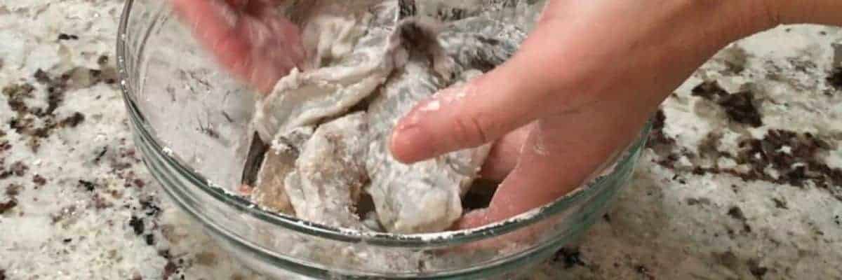 tossing shrimp in cornstarch
