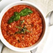 Pappa al Pomodoro served in a white bowl on a linen napkin