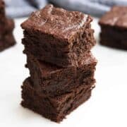 Almond Flour Brownies stacked on a white board
