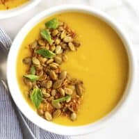 Delicata Squash Soup served in a white bowl