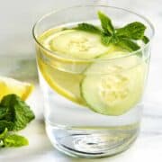 Cucumber Lemon Mint Water in a glass tumbler