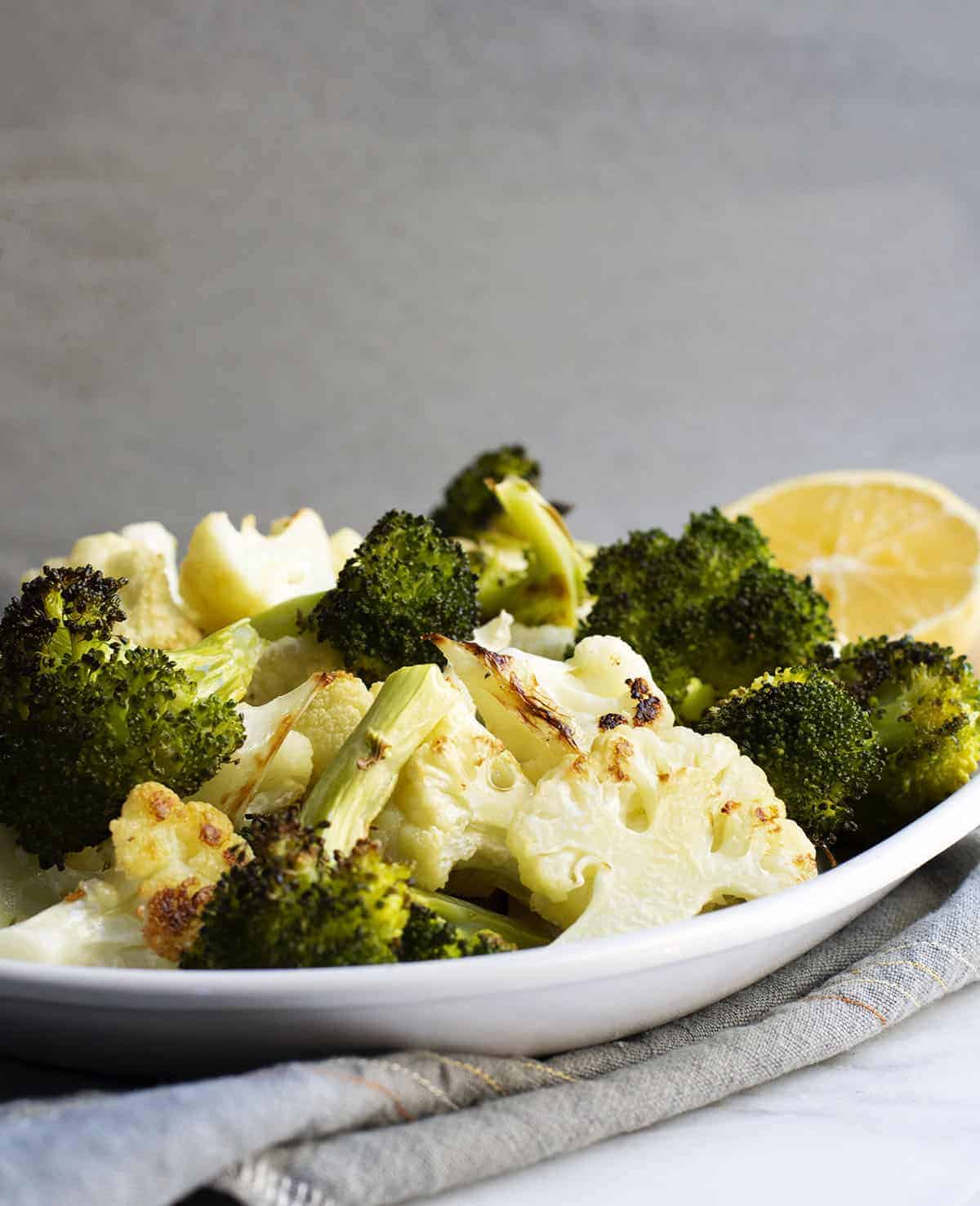 Roasted Broccoli and Cauliflower served on a white platter