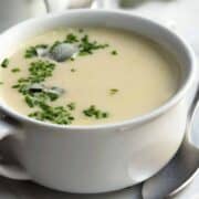 Tuscan White Bean Soup served in a white ceramic bowl