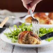 cutting Chicken Ballotine with fork and knife