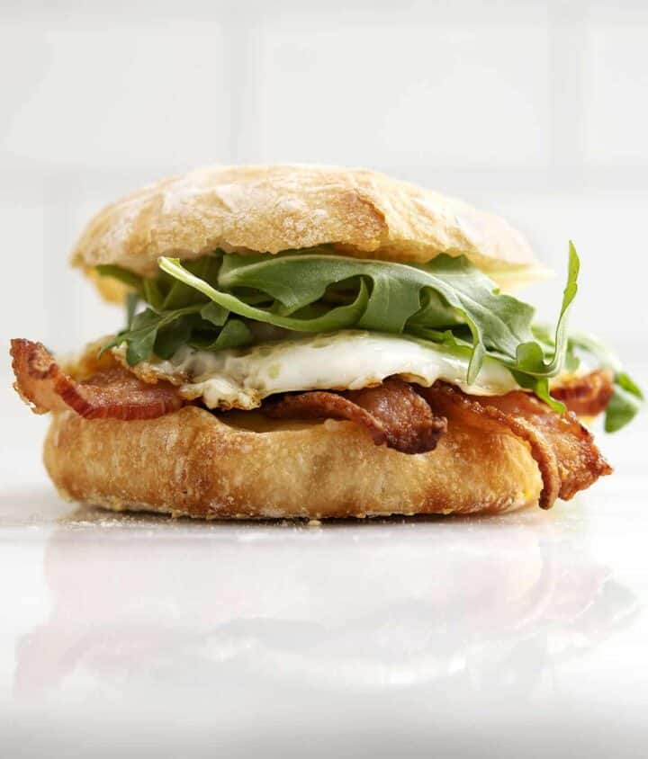 English Muffin Breakfast Sandwich with Bacon Fried Egg and Cheddar