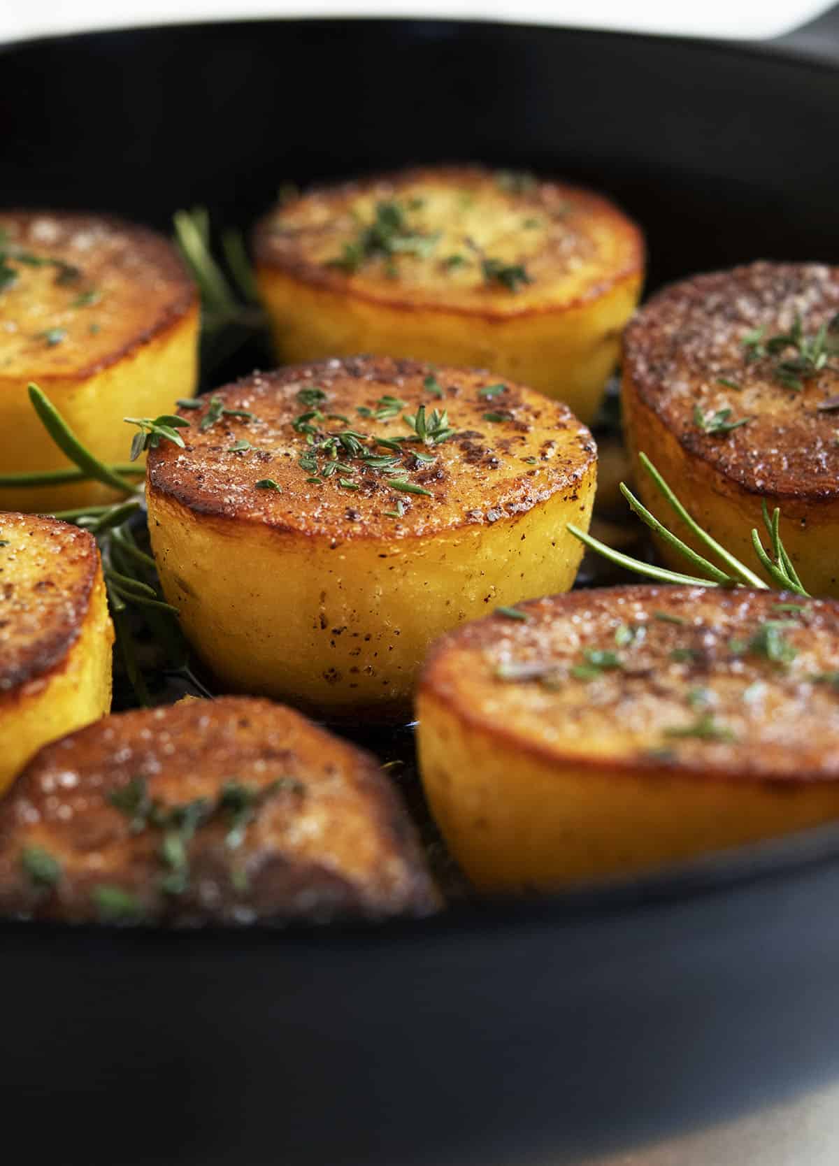 Gold Potatoes With Bacon in a Cast Iron Skillet 