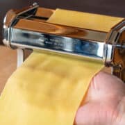 Final Pass of pasta dough through machine rollers