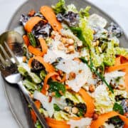 Butter Lettuce Salad served on a gray oval platter.