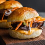 Pork Belly Sliders on a wooden serving board