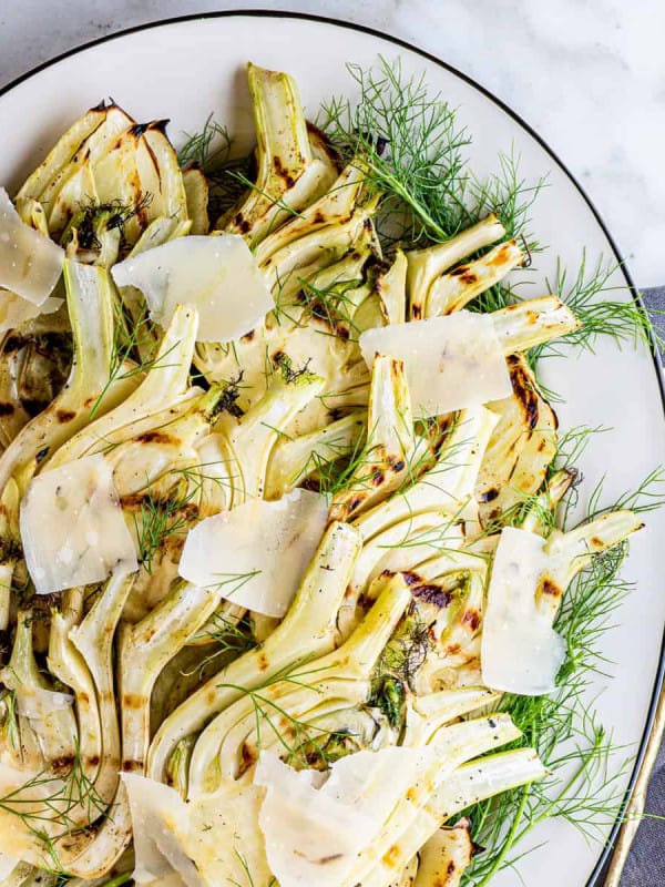 Grilled Fennel on an oval white platter photographed from above.