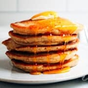 oat flour pancakes with butter and maple syrup.