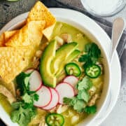 Chicken Pozole Verde served in a white bowl.