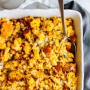 Cornbread Dressing served in a white baking dish.