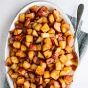 Cajun Potatoes served on a white oval platter photographed from above.