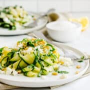 Zucchini Salad served on white plates.