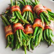 Bacon Wrapped Green Beans served on a white plate.
