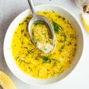 Garlic Butter Sauce for Seafood served in a white bowl and photographed from the top.