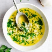 Garlic Butter Sauce served in a white bowl and photographed from above.