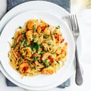 Shrimp Fra Diavolo served on a white shallow bowl and photographed from above.