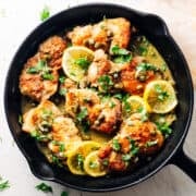 Chicken Thigh Piccata in a cast iron skillet.