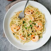 Garlic Butter Shrimp Pasta served in a white bowl and photographed from overhead.