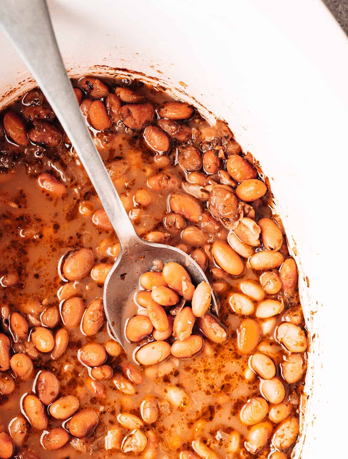 https://pinchandswirl.com/wp-content/uploads/2023/01/Slow-Cooker-Pinto-Beans_.jpg