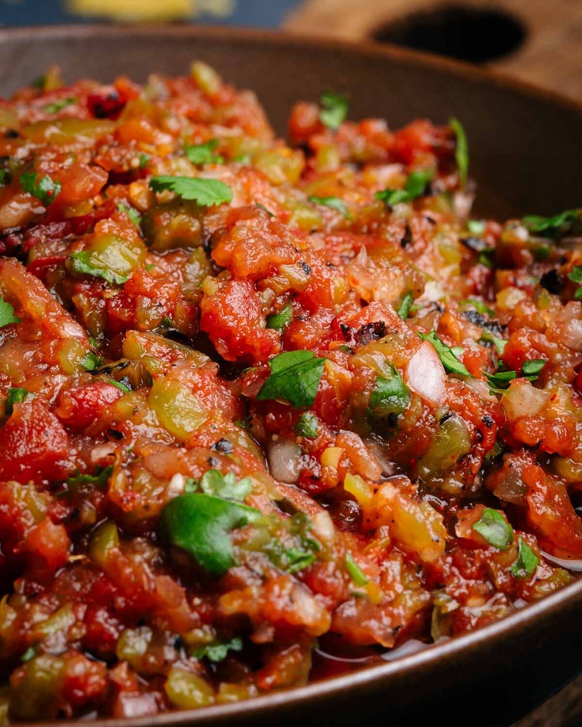 Closeup of Fire Roasted Salsa in a brown bowl.