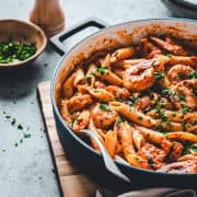 Cajun Shrimp Pasta served in a skillet and photographed at an angle.