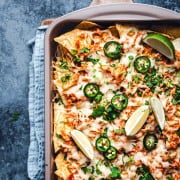 Shredded Chicken Nachos in a rimmed baking sheet photographed from the top.