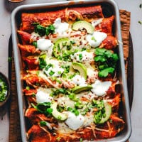 Ground Turkey Enchiladas served in a metal pan.