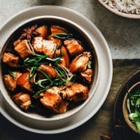 Braised Pork Belly served in a white ceramic bowl and photographed from overhead.