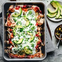 Fully baked steak enchiladas in baking pan.